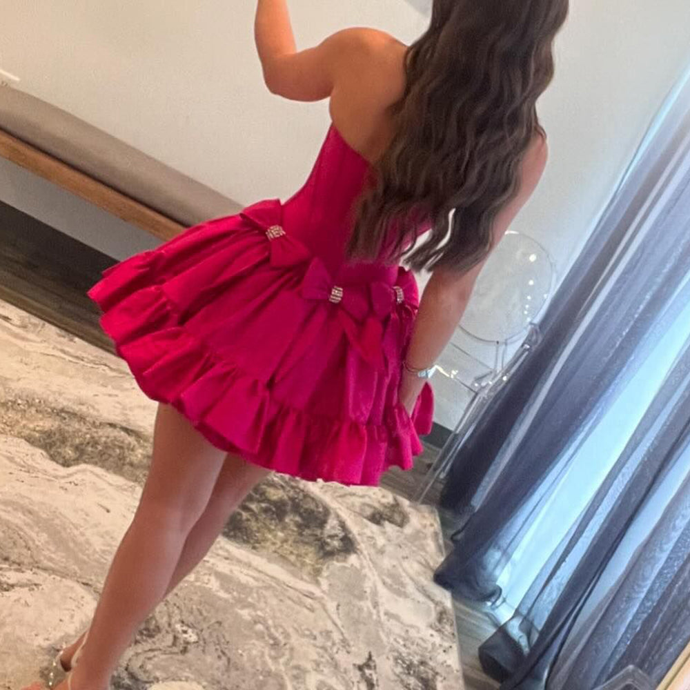 
                  
                     A Line Black Strapless Corset Ruffled Short Homecoming Dress With Bows
                  
                