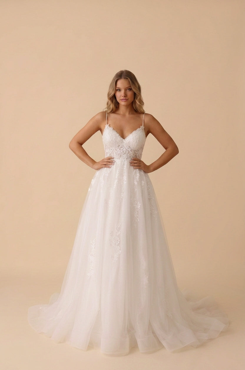 White A-line wedding dress with a V-neck lace bodice and spaghetti straps, front view