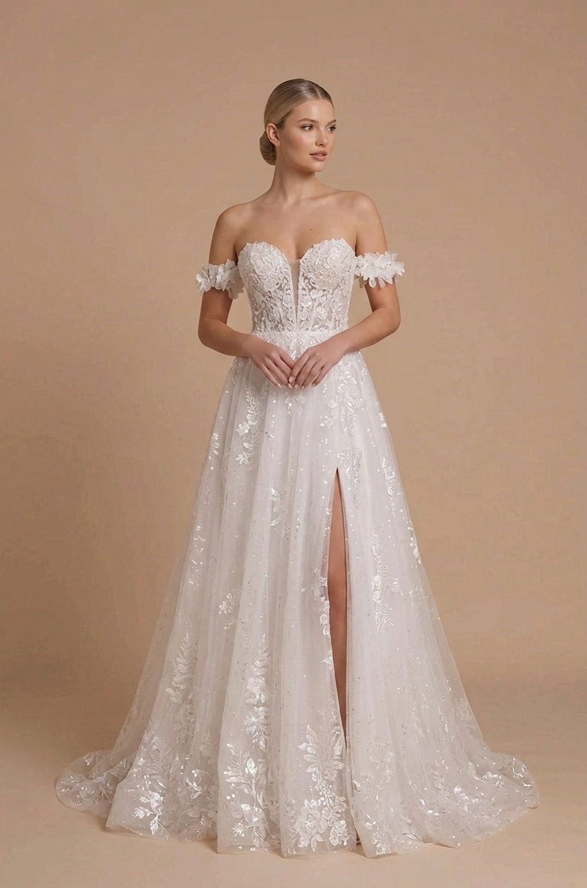 Front view of a white off-the-shoulder wedding dress with a sweetheart neckline, floral arm straps, a front slit and a floor-length A-line lace skirt.